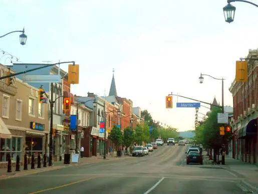 Small-town main street with red traffic lights